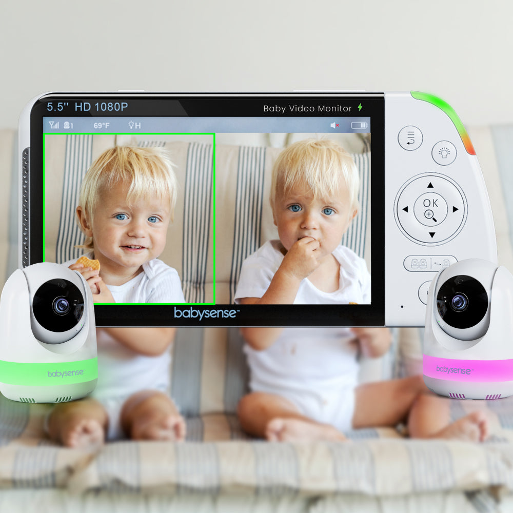 Baby video monitor with two cameras showing a child on the screen.