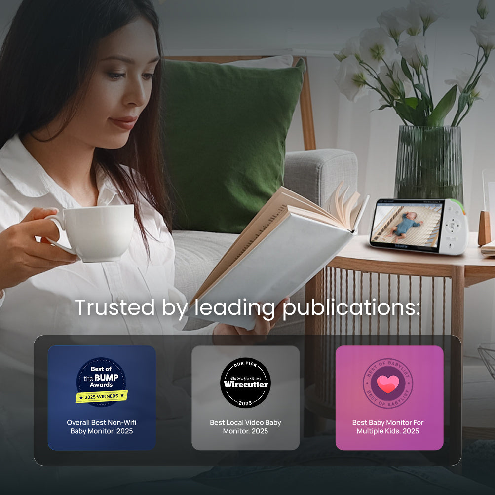 Woman reading a book and holding a cup in a cozy living room with awards displayed below.